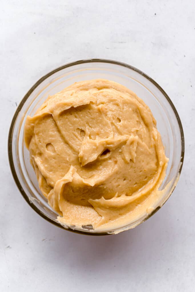 Madeleine batter mixed in a bowl.