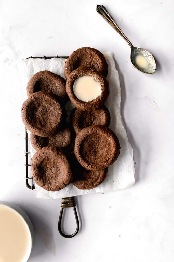 Dark chocolate thumbprints on a wire rack