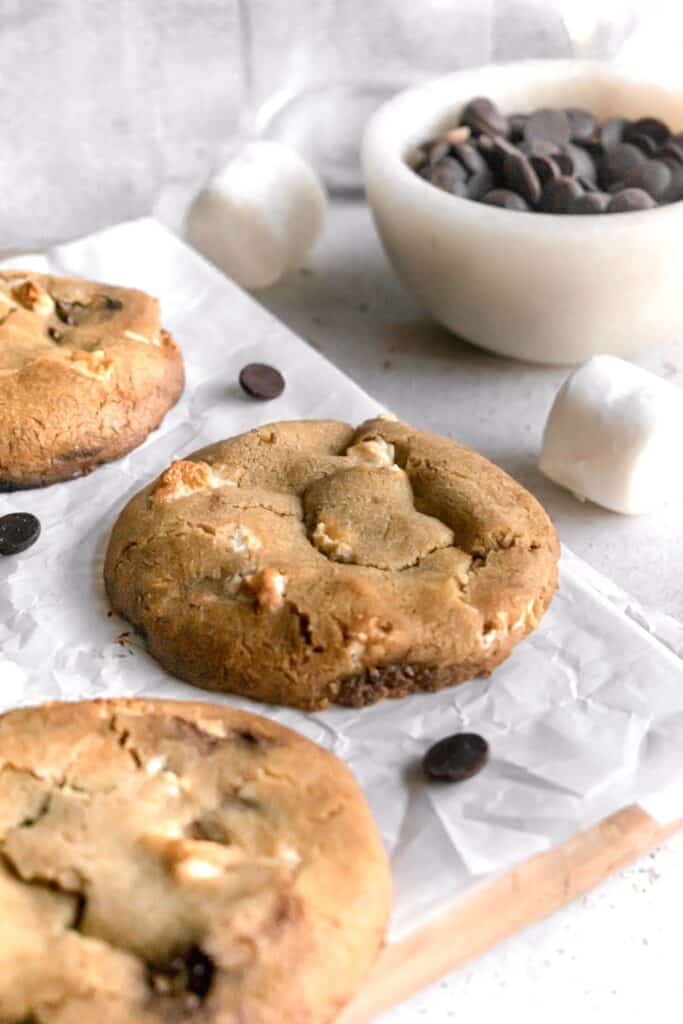 Large chocolate chip marshmallow cookie on a parchment paper