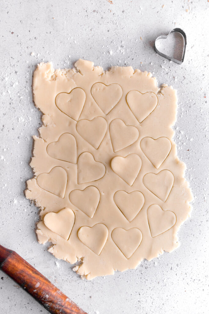 baked heart shaped shortbread cookie dough rolled out