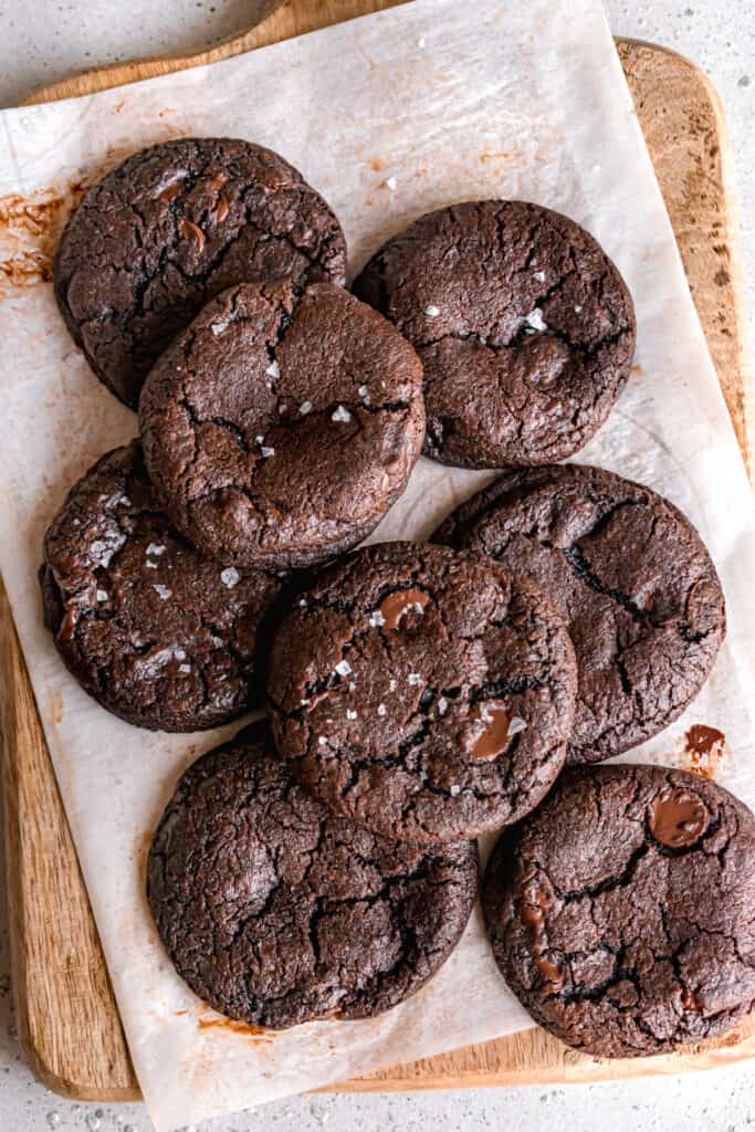 double dark chocolate cookies on a wooden board