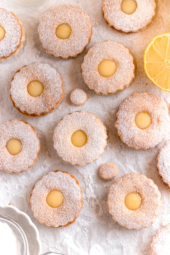 lemon curd linzer cookies on a parchment paper