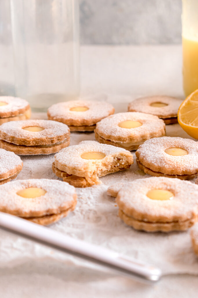 lemon curd linzer cookies on a parchment paper